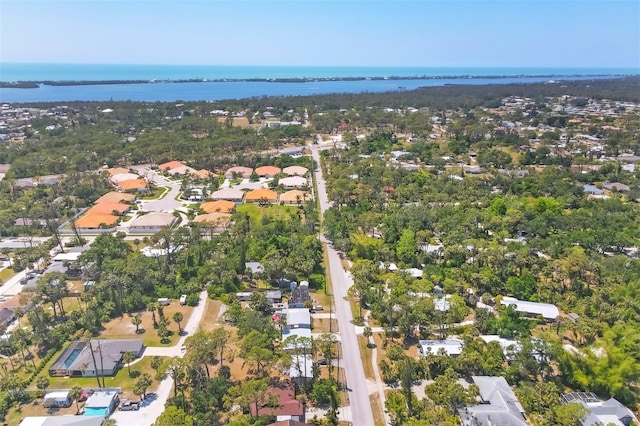 bird's eye view featuring a residential view and a water view