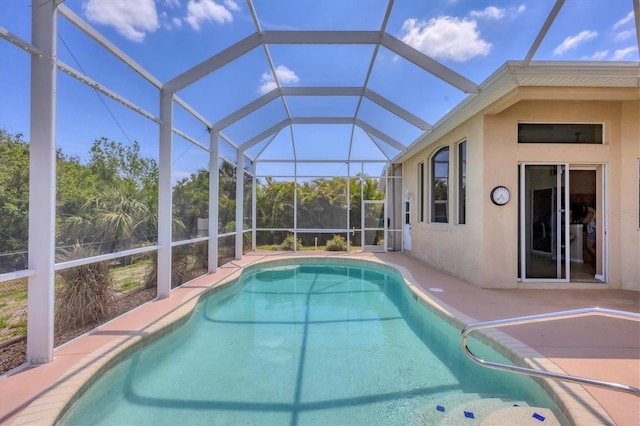 pool with a patio and a lanai