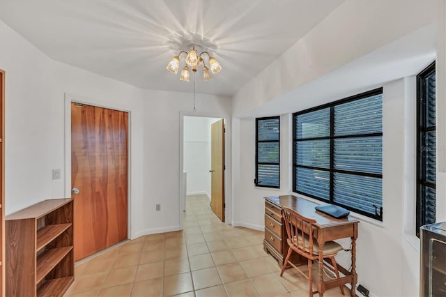 office featuring light tile patterned floors and baseboards