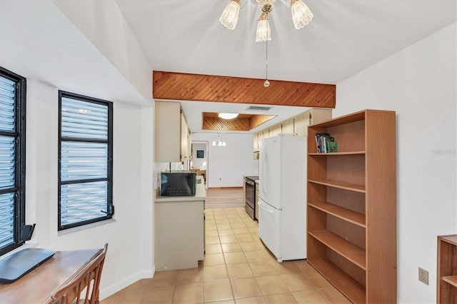 kitchen featuring electric stove, visible vents, freestanding refrigerator, open shelves, and black microwave