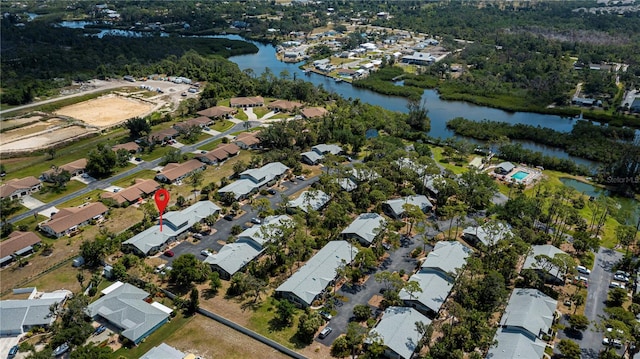 drone / aerial view with a water view and a residential view