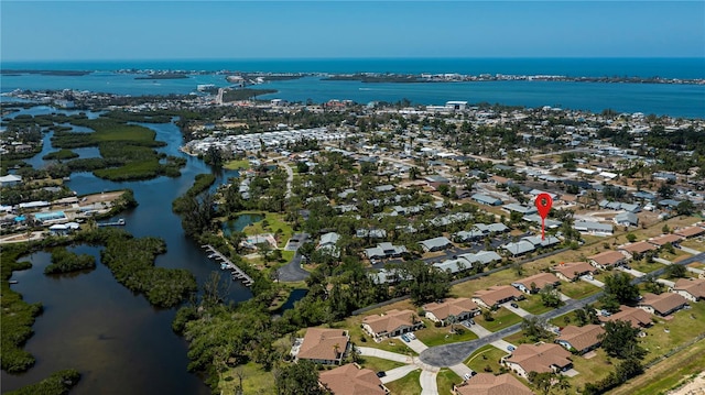 bird's eye view featuring a water view and a residential view