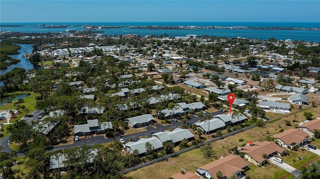 bird's eye view with a water view and a residential view