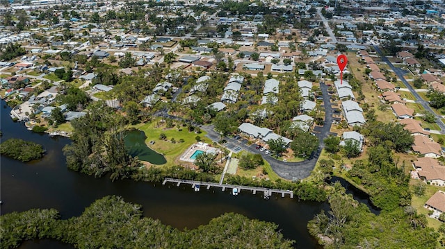 birds eye view of property with a water view and a residential view