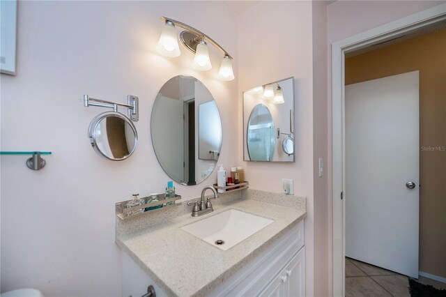 bathroom featuring tile patterned floors and vanity