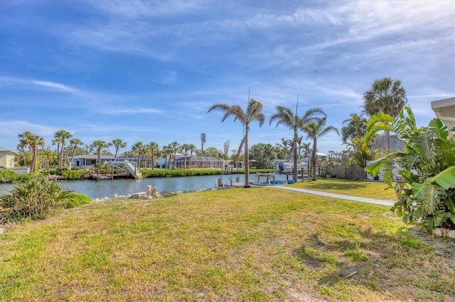 exterior space with a dock and a water view