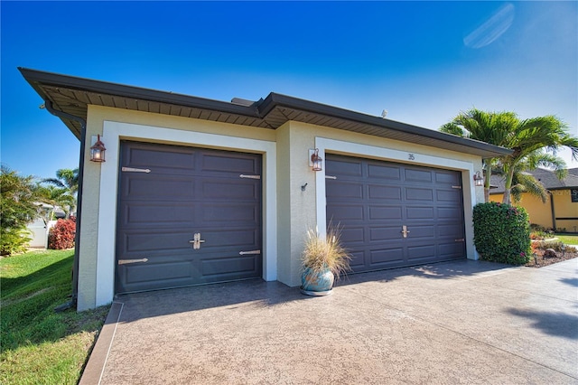 35 Medalist Rd, Rotonda West, FL 33947 - garage with concrete driveway