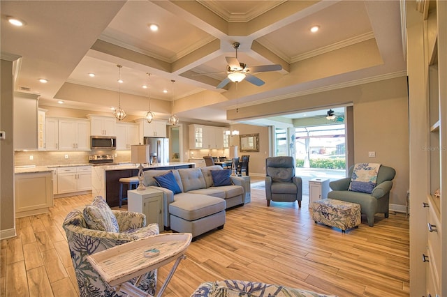 35 Medalist Rd, Rotonda West, FL 33947 - living room featuring light wood-style floors, ornamental molding, a ceiling fan, coffered ceiling, and beam ceiling
