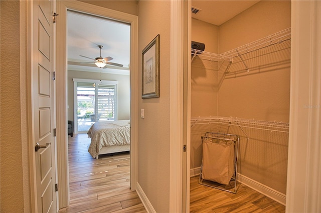 35 Medalist Rd, Rotonda West, FL 33947 - walk in closet with wood finished floors and a ceiling fan