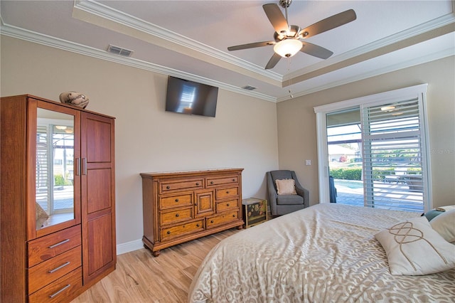 35 Medalist Rd, Rotonda West, FL 33947 - bedroom featuring a raised ceiling, access to outside, light wood-style floors, crown molding, and ceiling fan