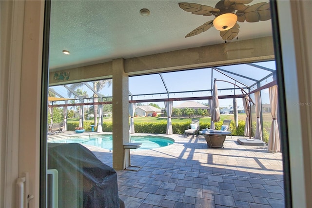 35 Medalist Rd, Rotonda West, FL 33947 - swimming pool with a patio area, a ceiling fan, and a lanai