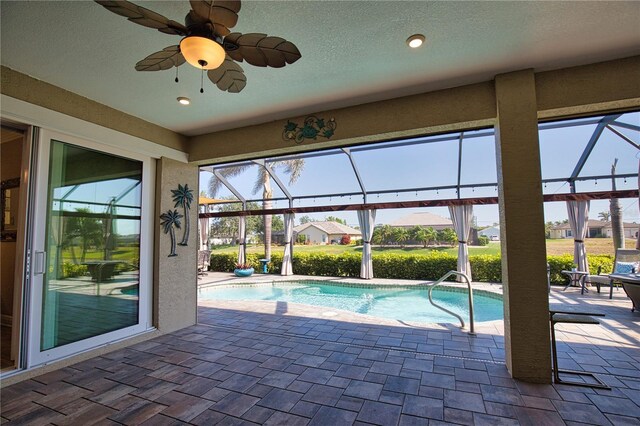 35 Medalist Rd, Rotonda West, FL 33947 - swimming pool with a patio area, glass enclosure, and ceiling fan