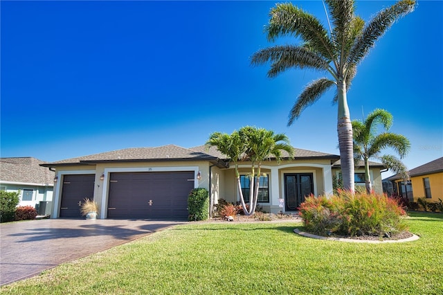 35 Medalist Rd, Rotonda West, FL 33947 - ranch-style house featuring a garage, a front yard, driveway, and stucco siding