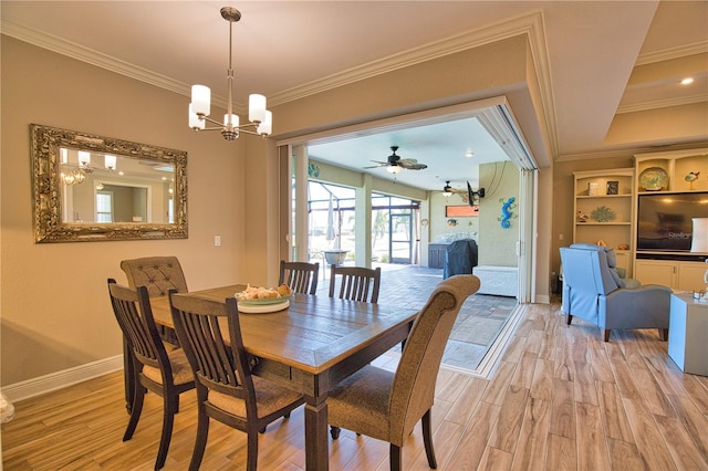 35 Medalist Rd, Rotonda West, FL 33947 - dining area with crown molding, a chandelier, light wood-style floors, and ceiling fan