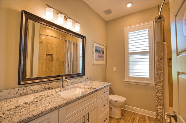 35 Medalist Rd, Rotonda West, FL 33947 - full bath with wood finished floors, vanity, and a shower with curtain