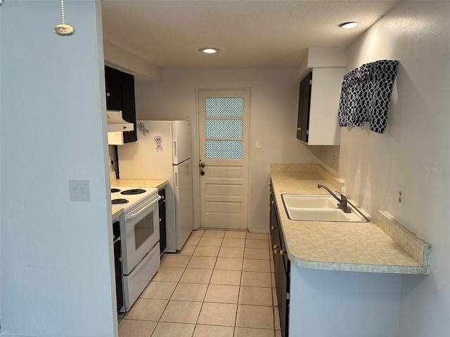 194 Garden Ave NW, Port Charlotte, FL 33952 - kitchen with a sink, white electric range, light countertops, under cabinet range hood, and light tile patterned floors