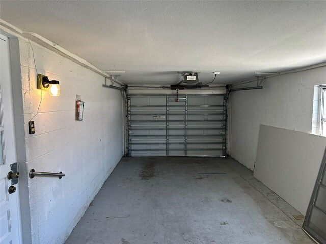 194 Garden Ave NW, Port Charlotte, FL 33952 - garage with a garage door opener