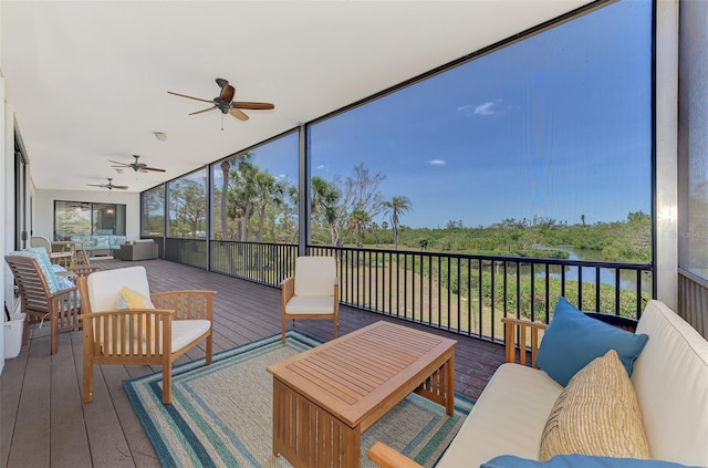 sunroom with ceiling fan and outdoor lounge area