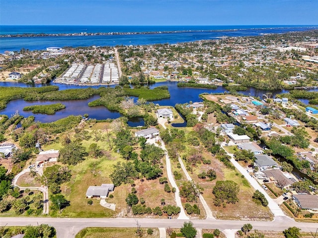 birds eye view of property featuring a water view and a residential view