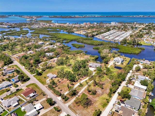 birds eye view of property featuring a water view and a residential view