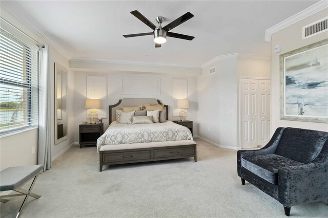 10805 Tarflower Dr Unit 101, Venice, FL 34293 - bedroom featuring light colored carpet, multiple windows, ornamental molding, and baseboards