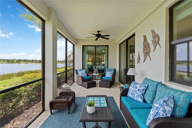 10805 Tarflower Dr Unit 101, Venice, FL 34293 - sunroom with a water view, outdoor lounge area, carpet, a ceiling fan, and a textured wall