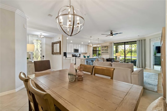 10805 Tarflower Dr Unit 101, Venice, FL 34293 - dining area with a chandelier, baseboards, a ceiling fan, ornamental molding, and light tile patterned floors