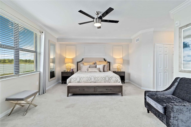 10805 Tarflower Dr Unit 101, Venice, FL 34293 - bedroom with light carpet, crown molding, baseboards, and a ceiling fan