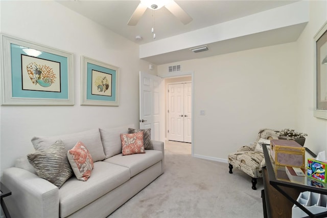 10805 Tarflower Dr Unit 101, Venice, FL 34293 - living area with light carpet, a ceiling fan, and baseboards