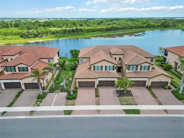 10805 Tarflower Dr Unit 101, Venice, FL 34293 - aerial view of property and surrounding area featuring a large body of water and a tree filled landscape