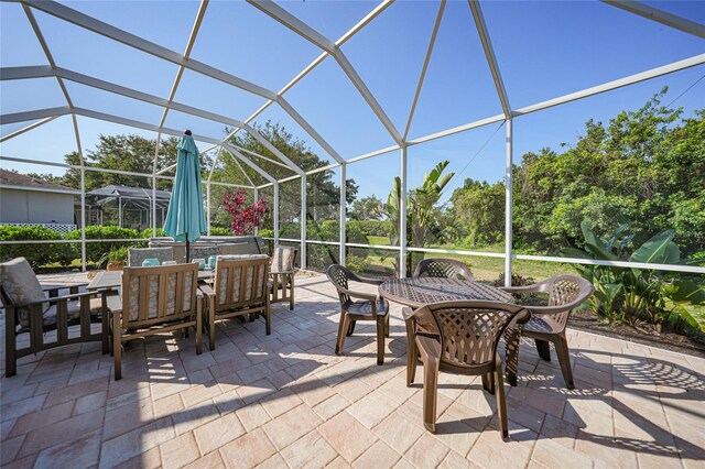 4004 Landor Ct, Venice, FL 34293 - view of patio / terrace featuring glass enclosure and outdoor dining space