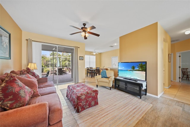 4004 Landor Ct, Venice, FL 34293 - living room featuring wood finished floors, a ceiling fan, and baseboards