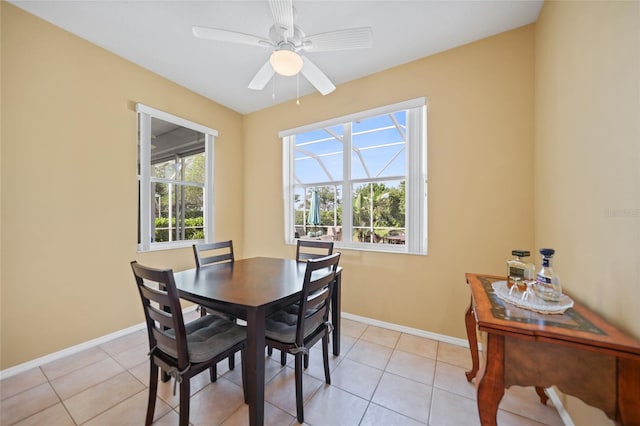 4004 Landor Ct, Venice, FL 34293 - dining room with baseboards, ceiling fan, and light tile patterned floors