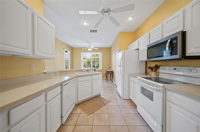 4004 Landor Ct, Venice, FL 34293 - kitchen with white cabinetry, a sink, and white appliances