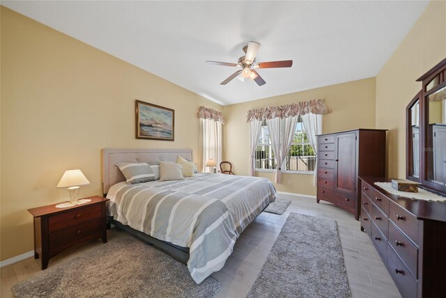 4004 Landor Ct, Venice, FL 34293 - bedroom with a ceiling fan, baseboards, and light wood-style floors