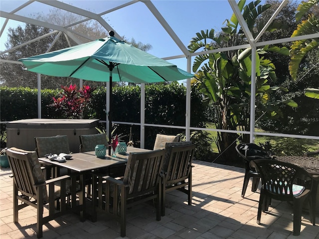 4004 Landor Ct, Venice, FL 34293 - view of patio / terrace with a lanai, a hot tub, and outdoor dining space