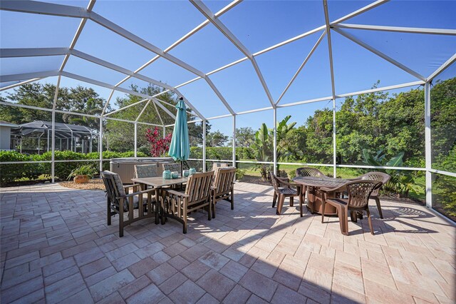 4004 Landor Ct, Venice, FL 34293 - view of patio with a lanai and outdoor dining area