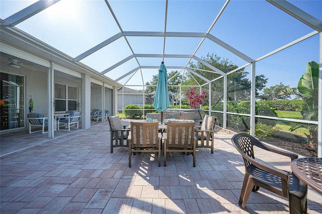 4004 Landor Ct, Venice, FL 34293 - view of patio / terrace with glass enclosure, outdoor dining space, and a ceiling fan