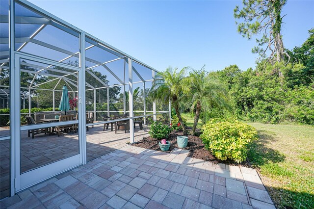 4004 Landor Ct, Venice, FL 34293 - view of patio / terrace featuring a lanai and outdoor dining space