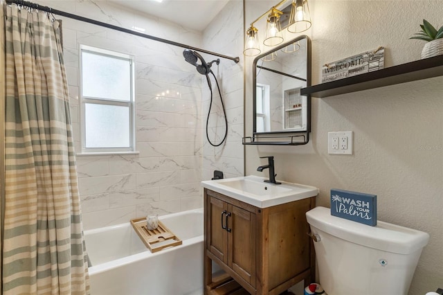 full bath with a textured wall, shower / bath combo, vanity, and toilet