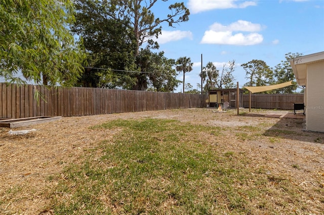 view of yard with a fenced backyard