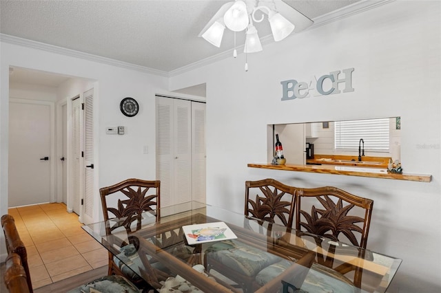 1531 Placida Rd Unit 201, Englewood, FL 34223 - tiled dining room featuring a ceiling fan, a sink, and ornamental molding