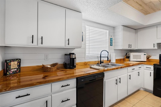 1531 Placida Rd Unit 201, Englewood, FL 34223 - kitchen with white cabinets, butcher block counters, a sink, and black appliances