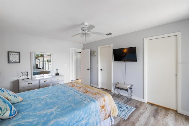 1531 Placida Rd Unit 201, Englewood, FL 34223 - bedroom featuring baseboards, a ceiling fan, wood finished floors, and visible vents