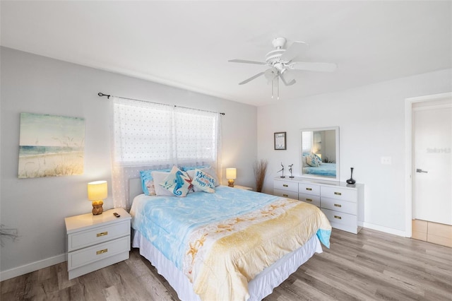 1531 Placida Rd Unit 201, Englewood, FL 34223 - bedroom featuring light wood-style flooring, baseboards, and ceiling fan
