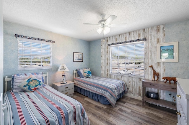 1531 Placida Rd Unit 201, Englewood, FL 34223 - bedroom featuring wood finished floors, a textured ceiling, and ceiling fan