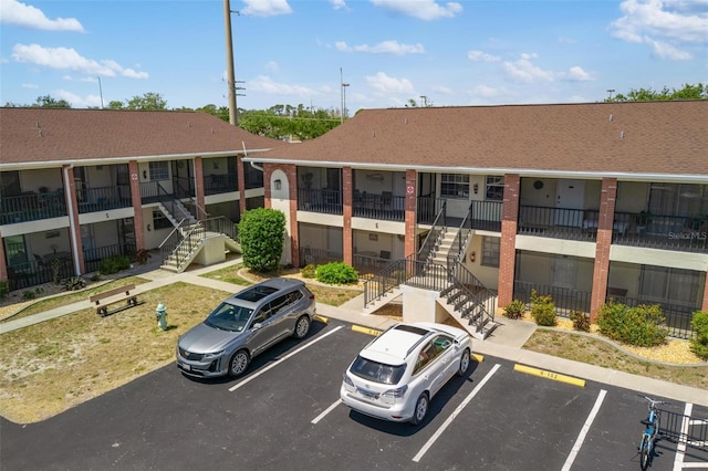 1531 Placida Rd Unit 201, Englewood, FL 34223 - view of property with stairs and uncovered parking