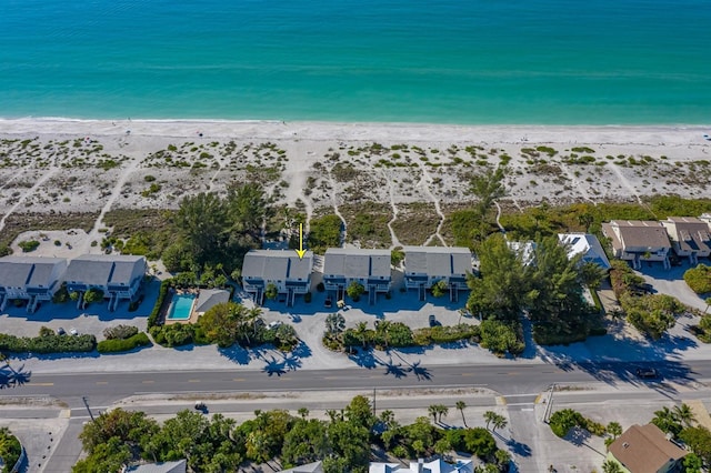 drone / aerial view with a view of the beach and a water view