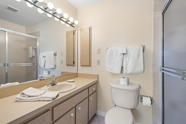 bathroom featuring toilet, a stall shower, vanity, baseboards, and visible vents