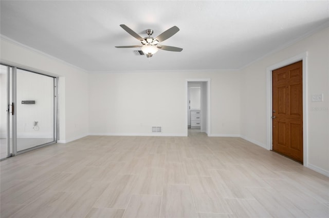 unfurnished room featuring ceiling fan, light wood-type flooring, crown molding, and visible vents